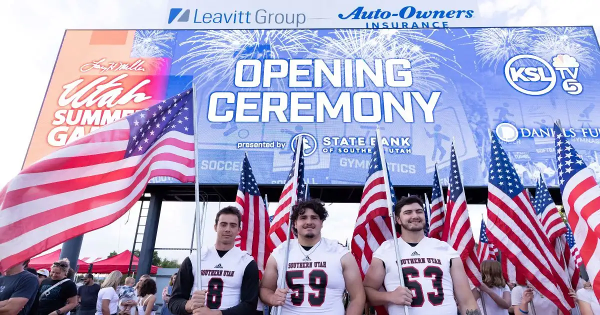 Football players with American flag and Opening Ceremony sign