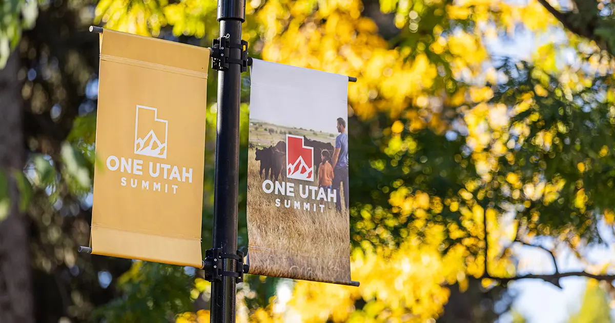 Hanging banners that say "One Utah Summit"