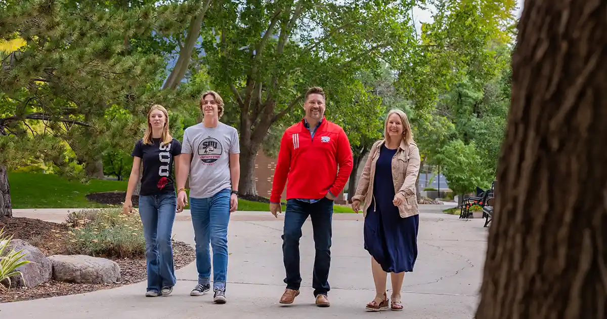 A family walks together on SUU campus. 
