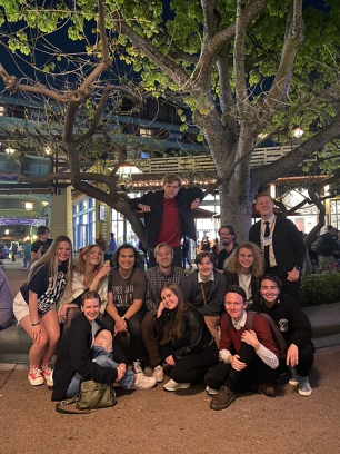 A group of Commercial Music students pose in front of a tree.