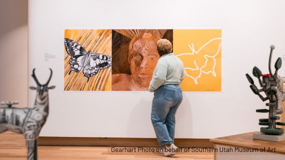 Photo of a student at the Faculty Exhibition at SUMA. Gearhart Photo.