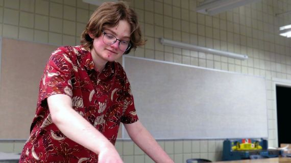 Photo of August Strouse working in the SUU printmaking lab.