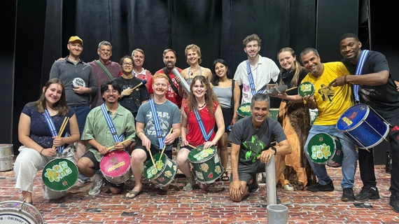 Students pose for a photo during a percussion workshop in Rio de Janeiro.