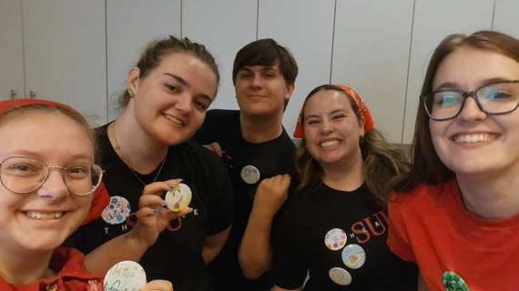Five Theatre Education capstone students pose after doing a craft associated with The Killer Quest.
