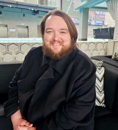 Headshot of Brandon Grayson.