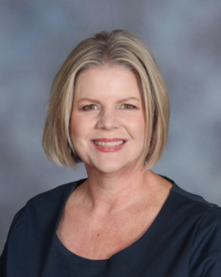 Professional headshot of Lisa Wells