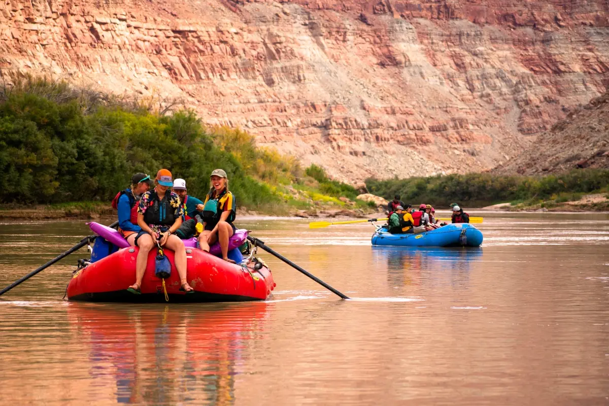 A group floating on an inflatable raft down a river 3
