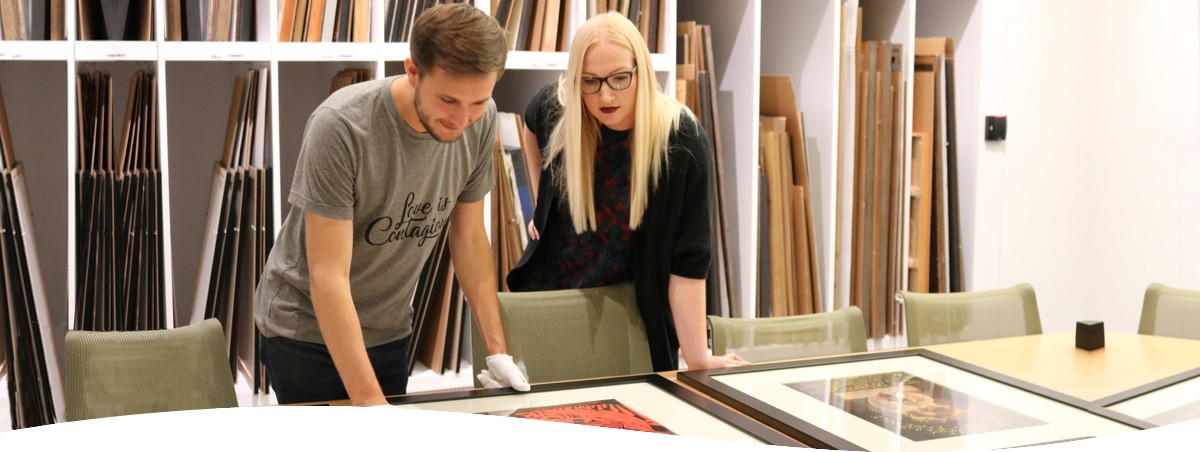 Student and Curator looking at art piece