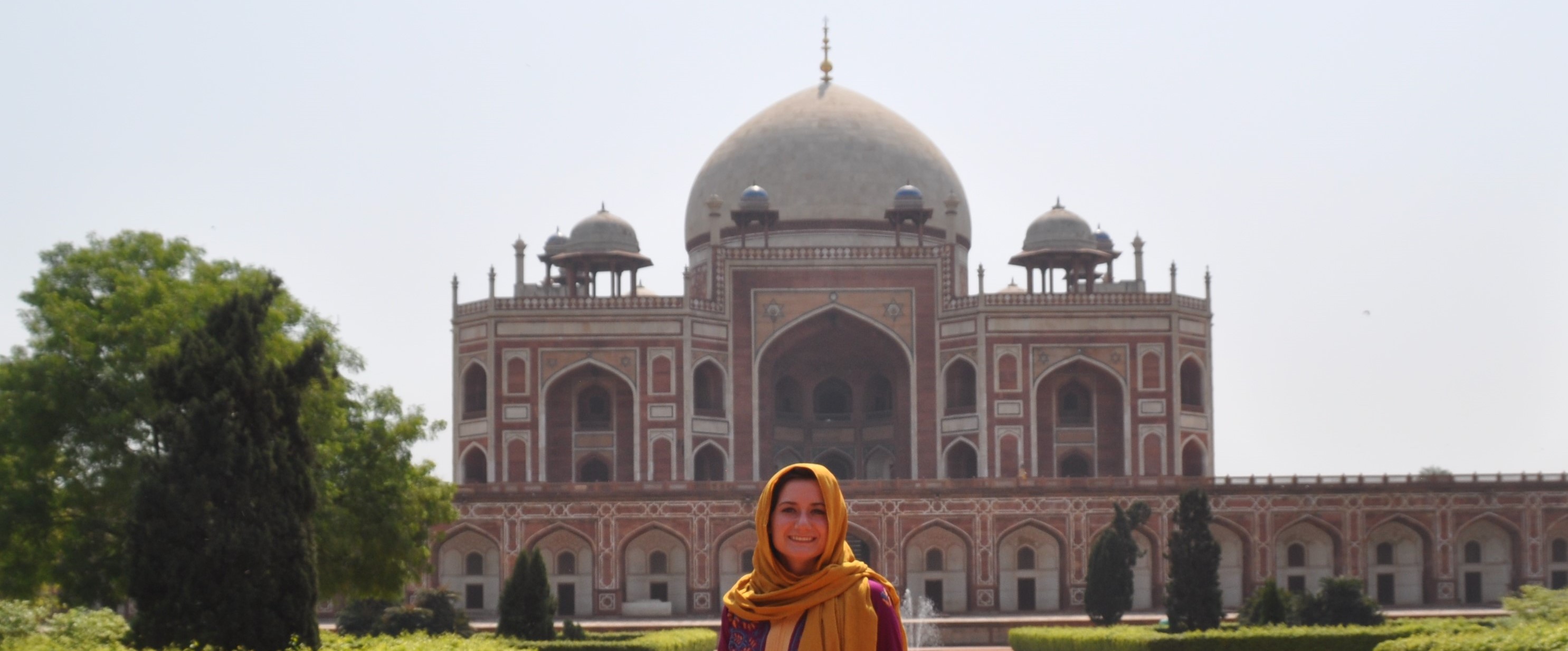 student in front of indian temple