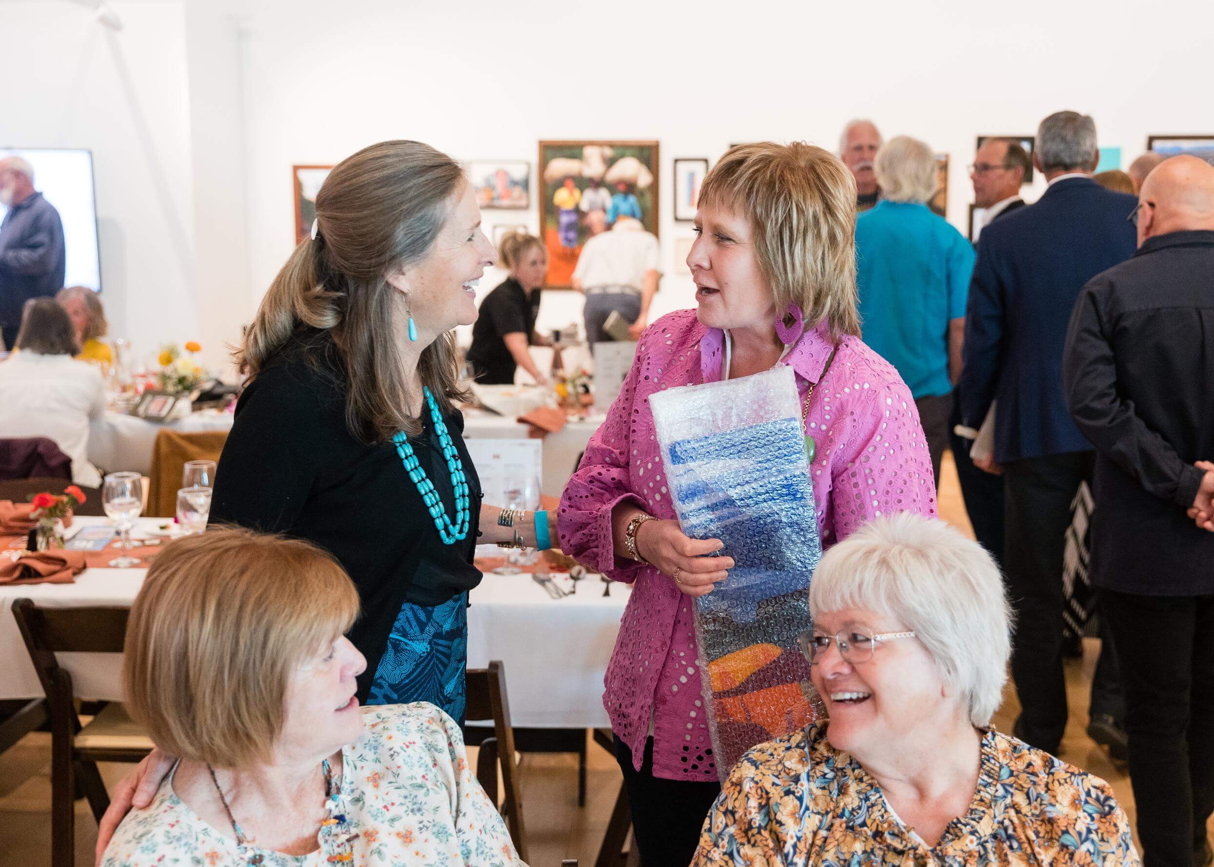 President Benson mingles at the Art Auction