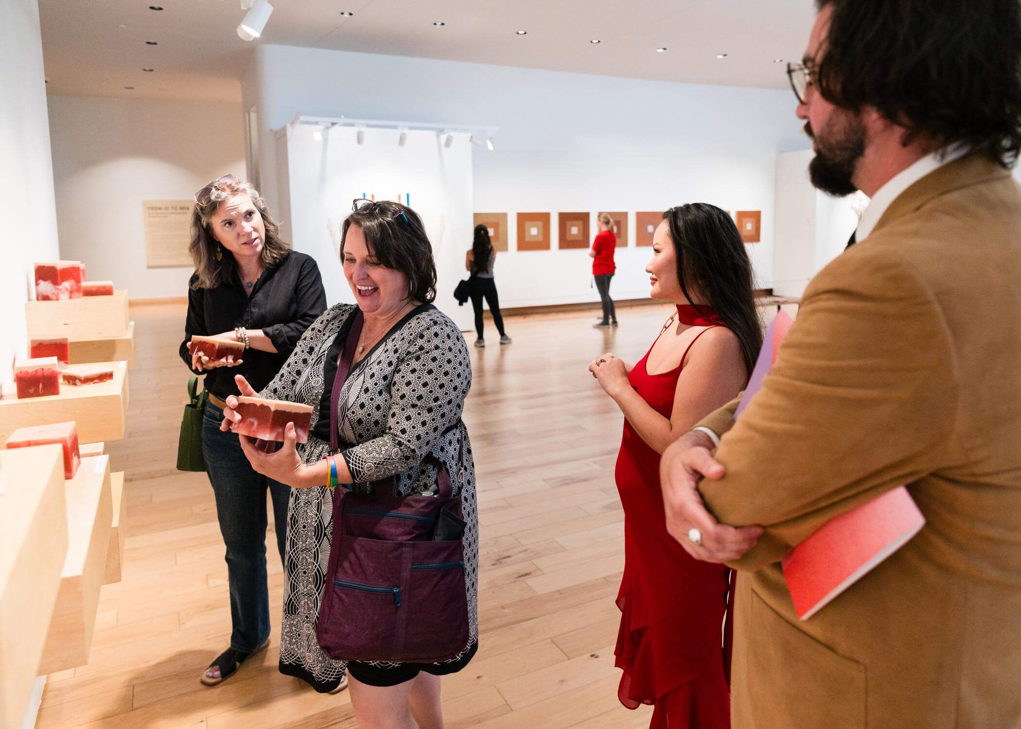 Members interact with a work on display