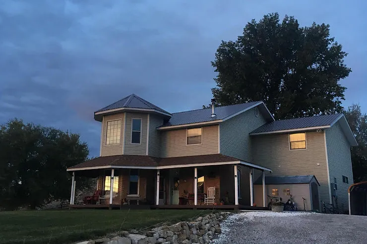 A photograph of a large house on a hill