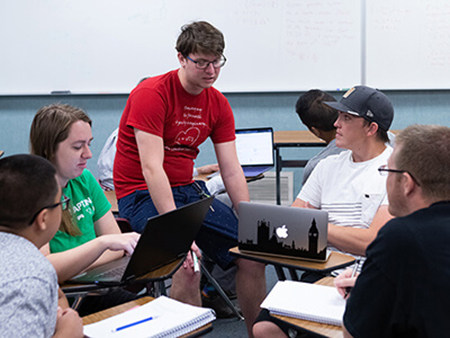A tutor leading a study group.